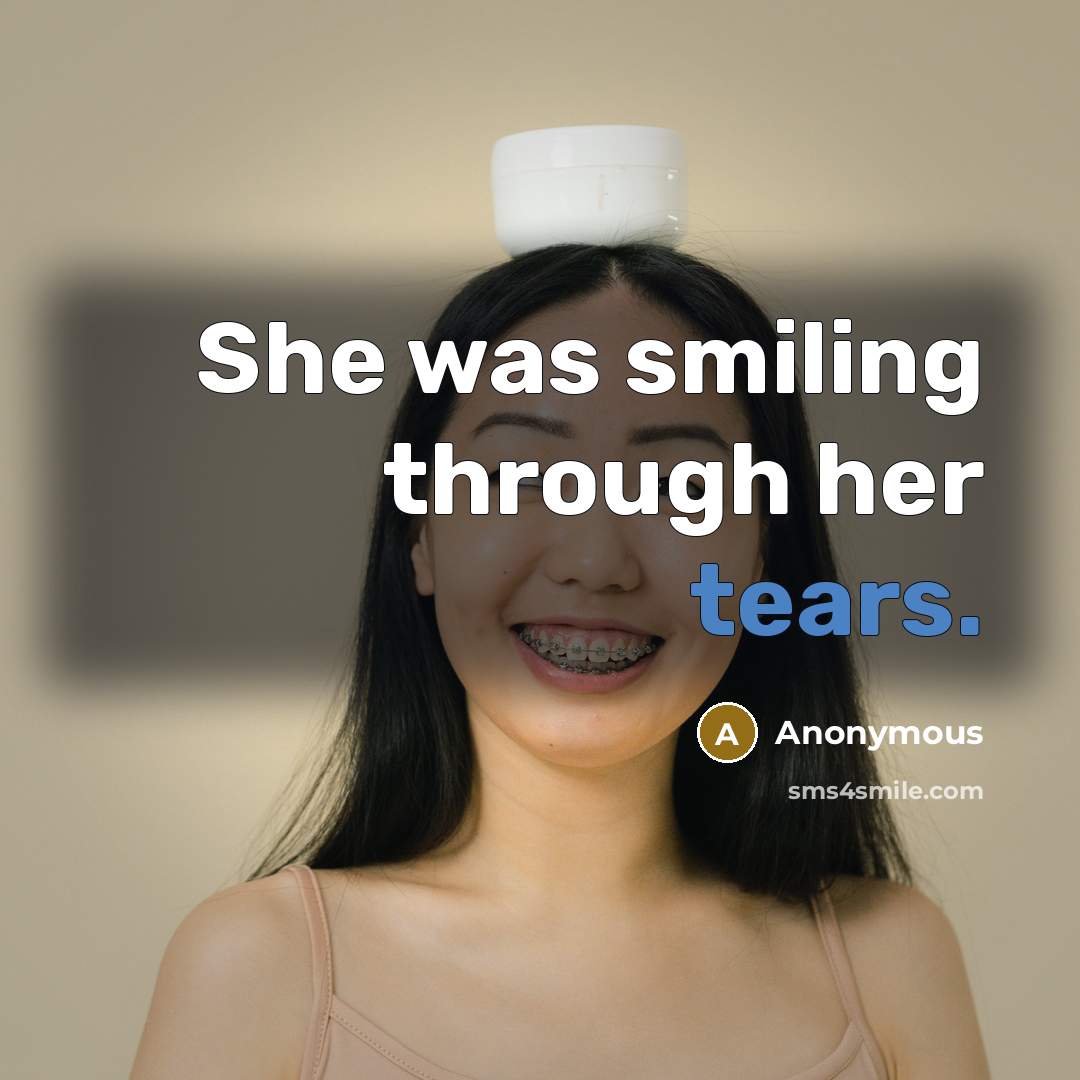 “She was smiling through her tears.” quote by Anonymous