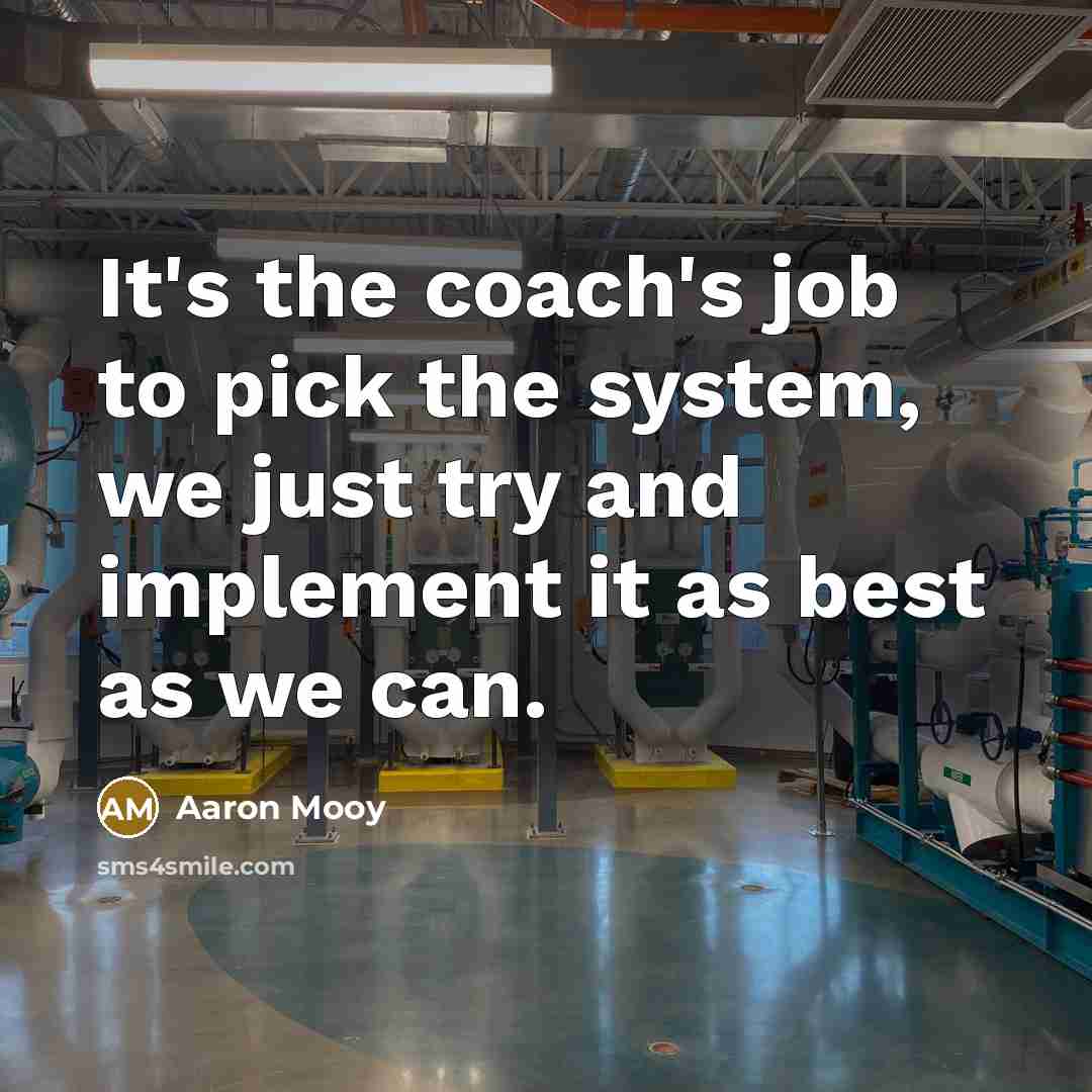 “It's the coach's job to pick the system, we just try and implement it as best as we can.” quote by Aaron Mooy