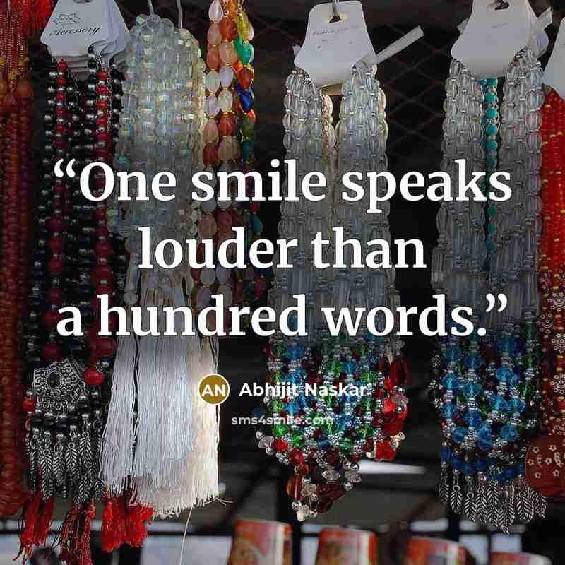 “One smile speaks louder than a hundred words.” quote by Abhijit Naskar
