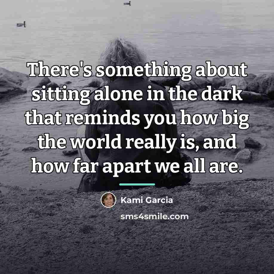 “There's something about sitting alone in the dark that reminds…” quote by Kami Garcia