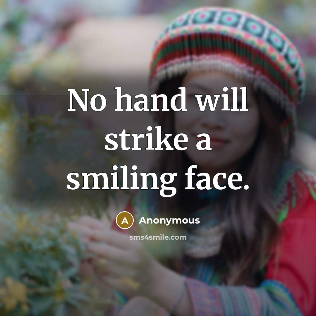 “No hand will strike a smiling face.” quote by Anonymous