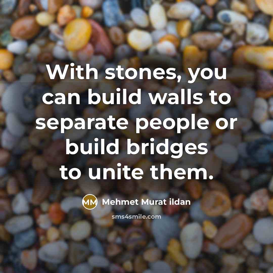 “With stones, you can build walls to separate people or…” quote by Mehmet Murat Ildan