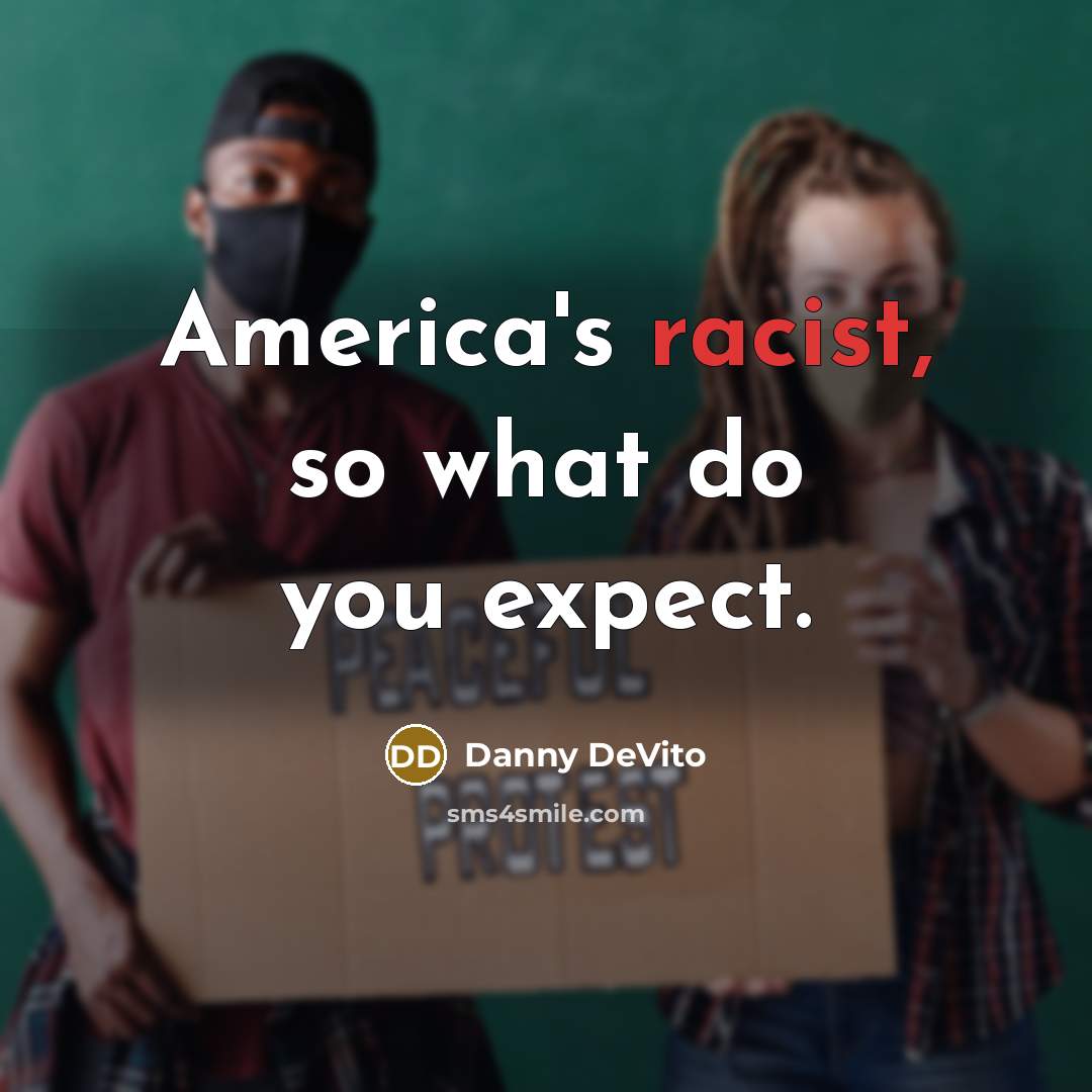 “America's racist, so what do you expect.…” quote by Danny DeVito
