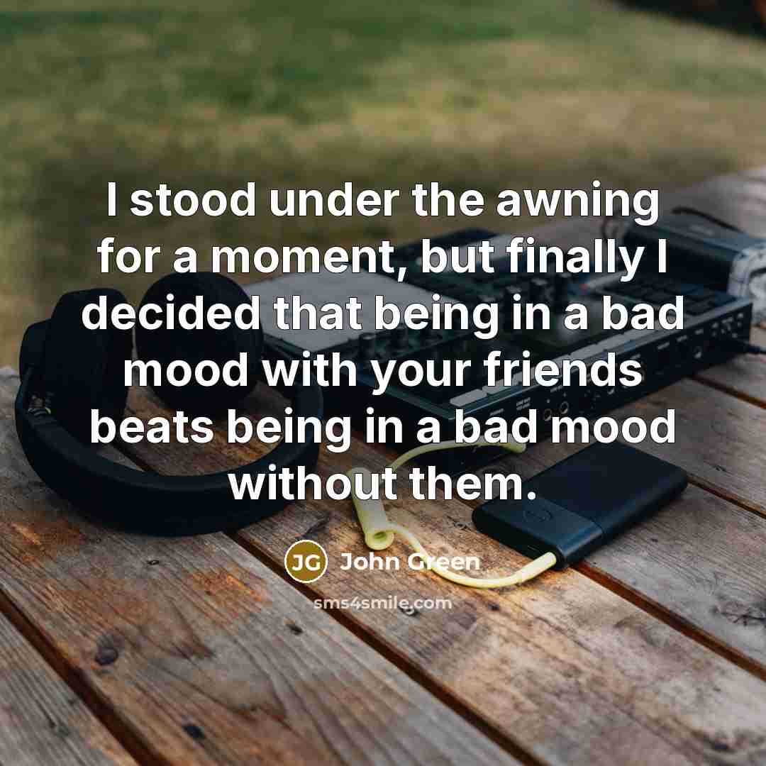 “I stood under the awning for a moment, but finally…” quote by John Green