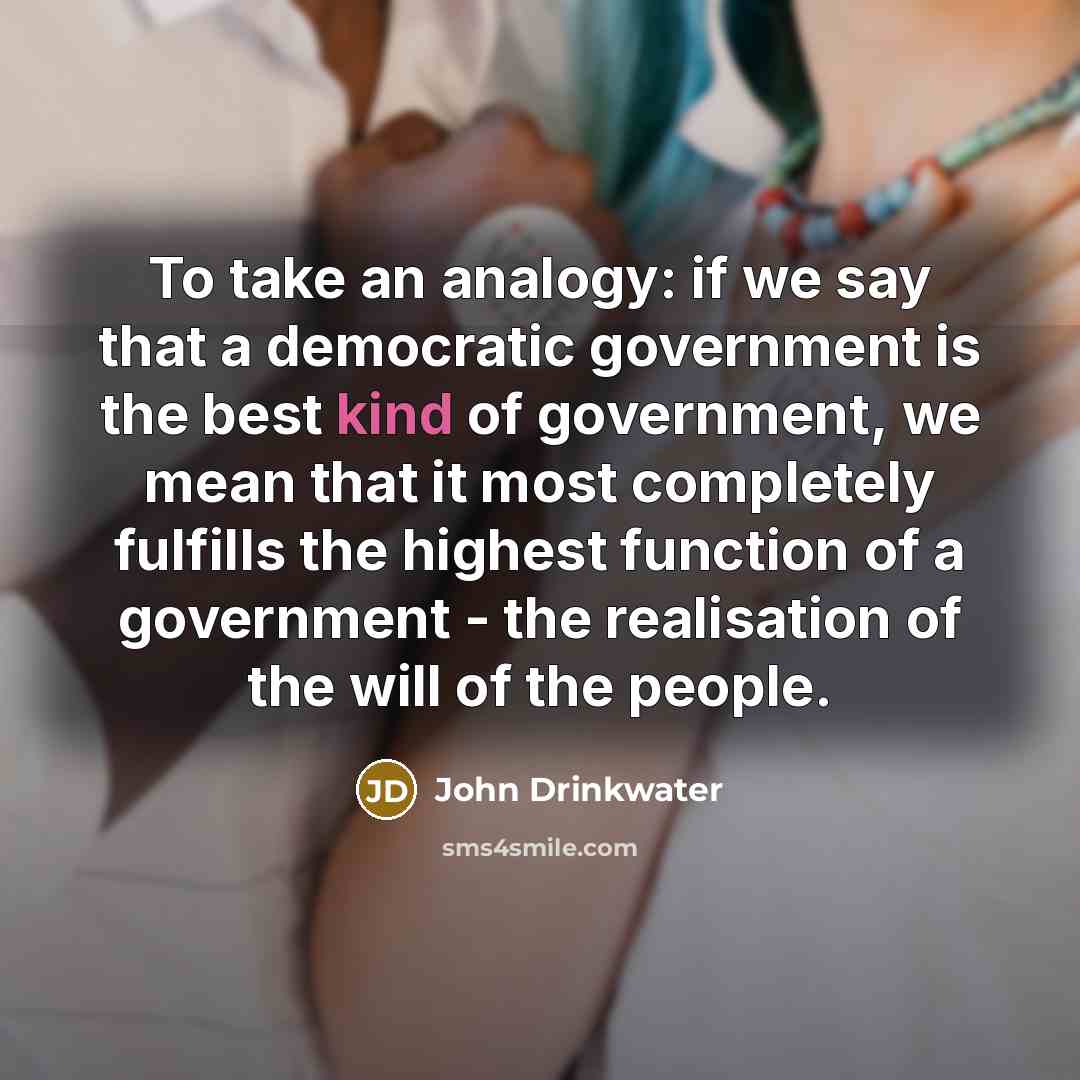 “To take an analogy: if we say that a democratic…” quote by John Drinkwater