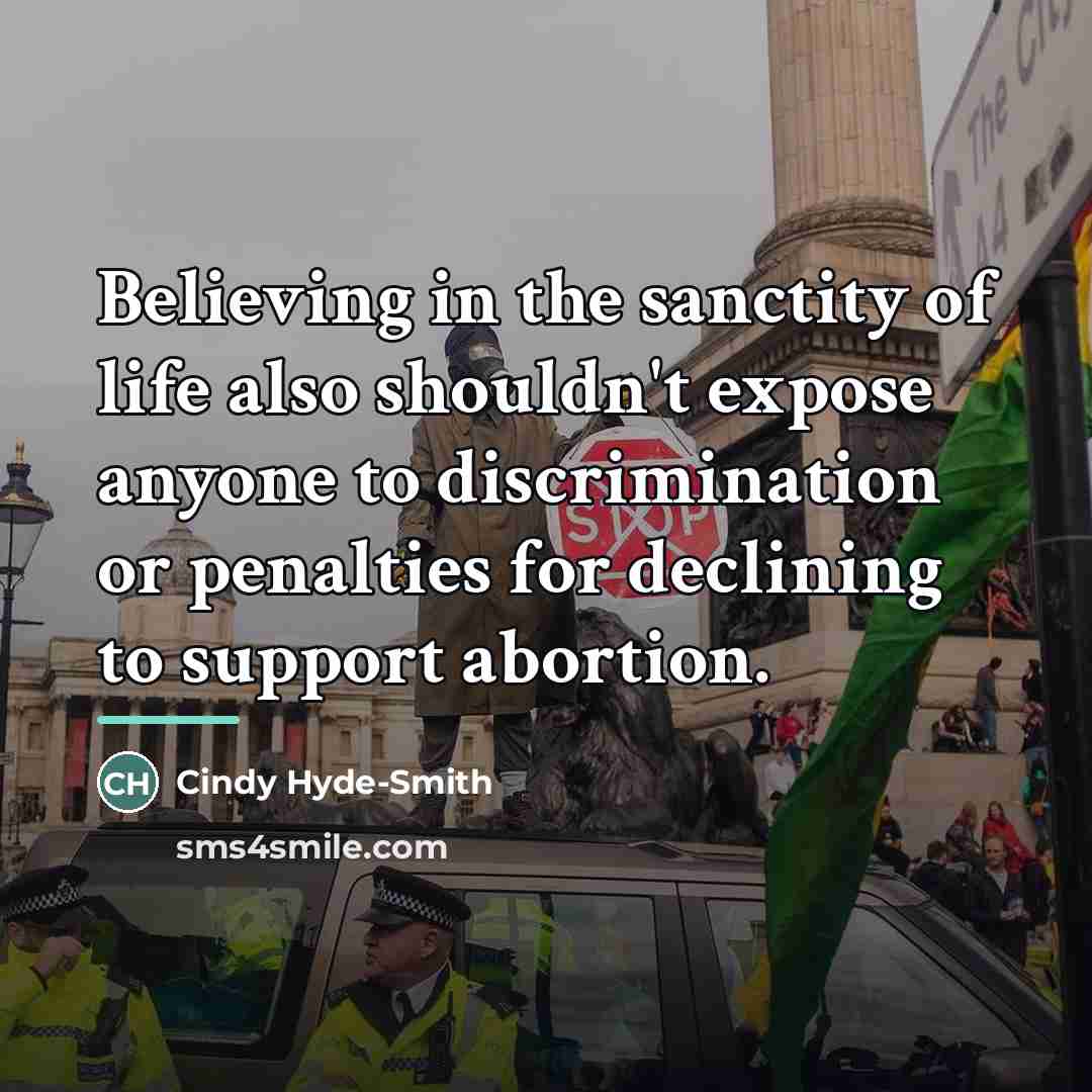 “Believing in the sanctity of life also shouldn't expose anyone…” quote by Cindy Hyde-Smith