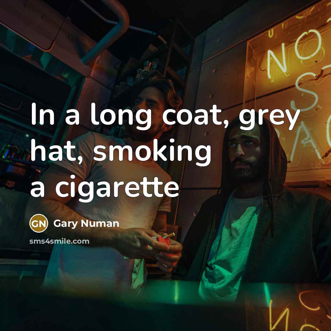 “In a long coat, grey hat, smoking a cigarette” quote by Gary Numan