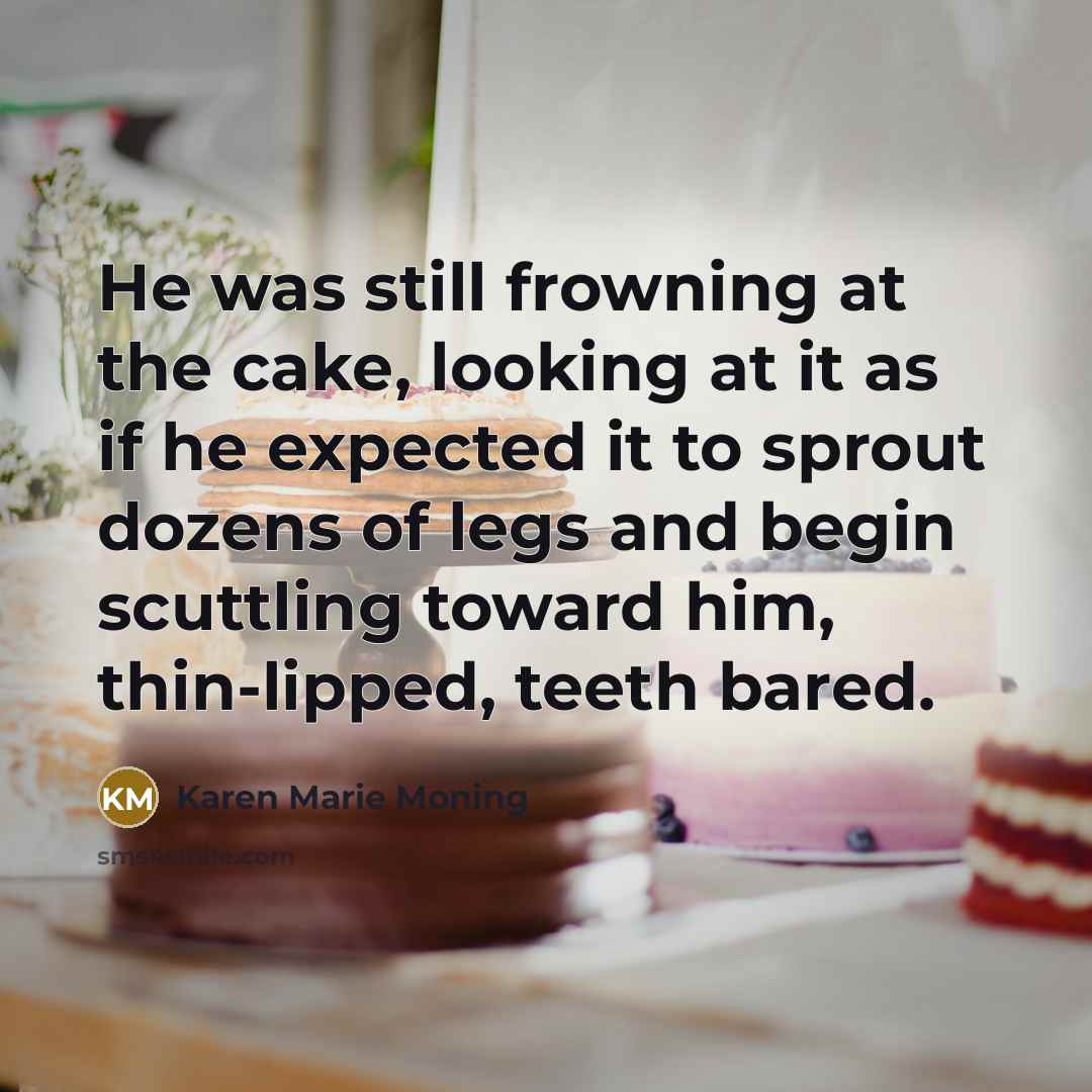 “He was still frowning at the cake, looking at it…” quote by Karen Marie Moning