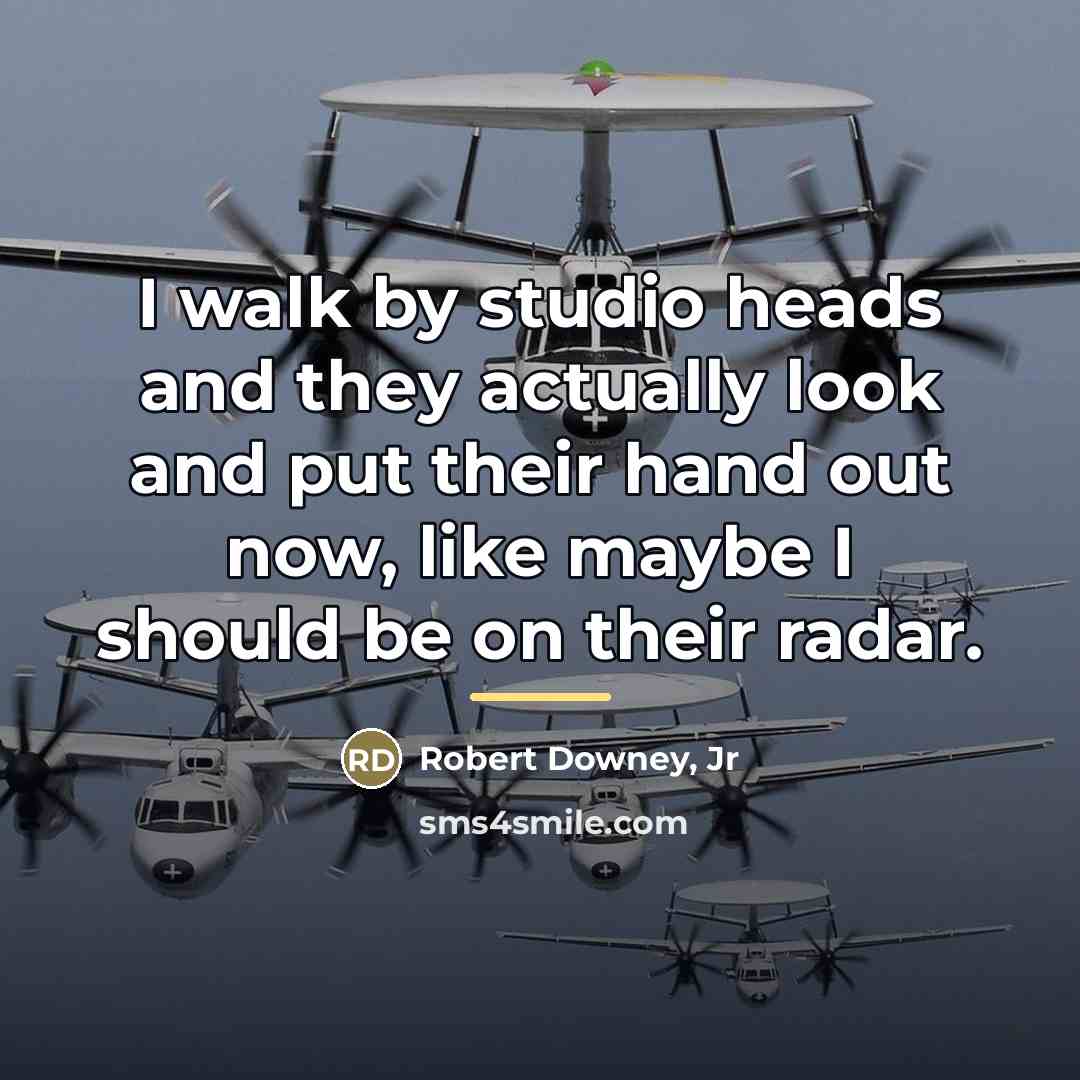“I walk by studio heads and they actually look and…” quote by Robert Downey, Jr