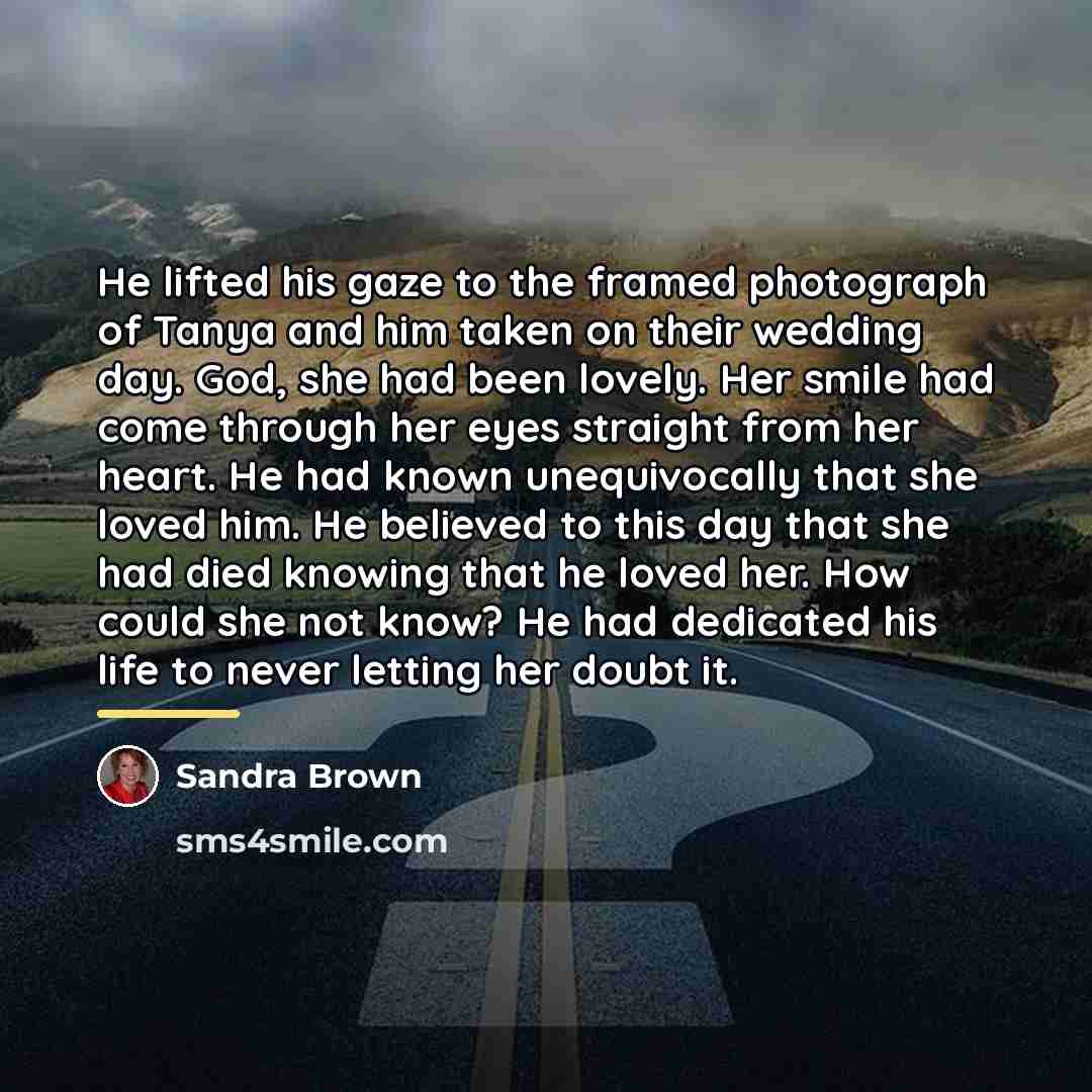 “He lifted his gaze to the framed photograph of Tanya…” quote by Sandra Brown
