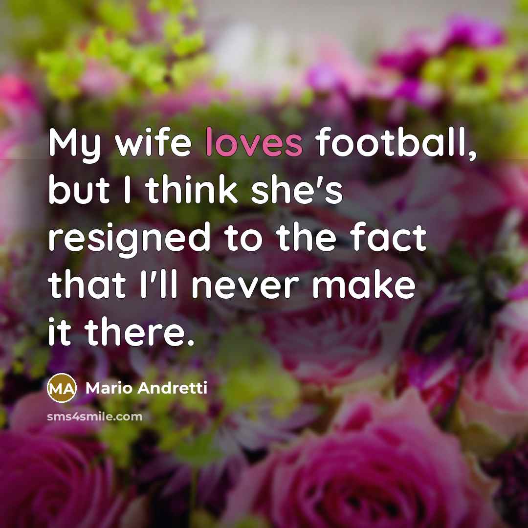 “My wife loves football, but I think she's resigned to…” quote by Mario Andretti