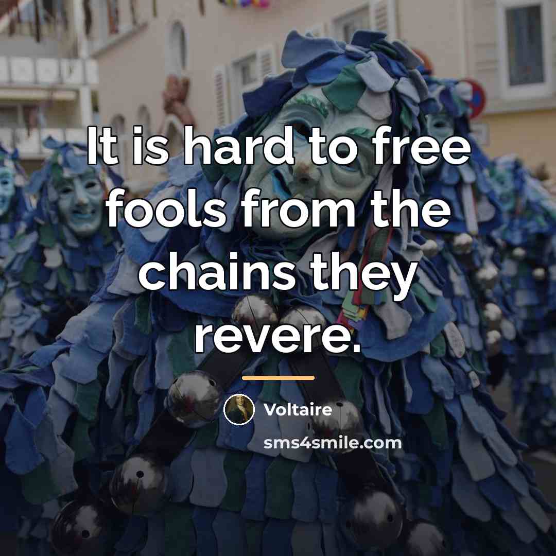 “It is hard to free fools from the chains they…” quote by Voltaire