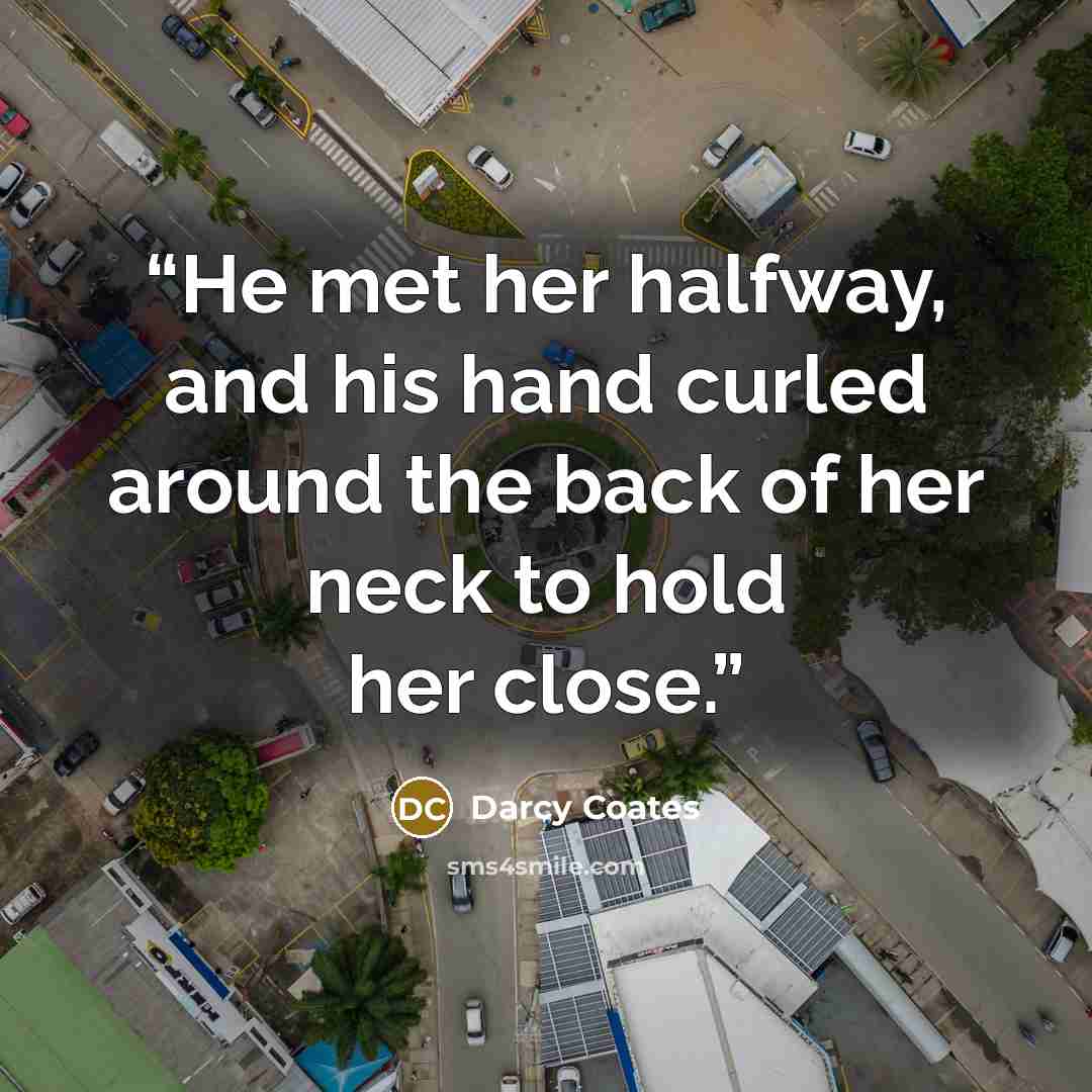 “He met her halfway, and his hand curled around the back of her neck to hold her close.” quote by Darcy Coates