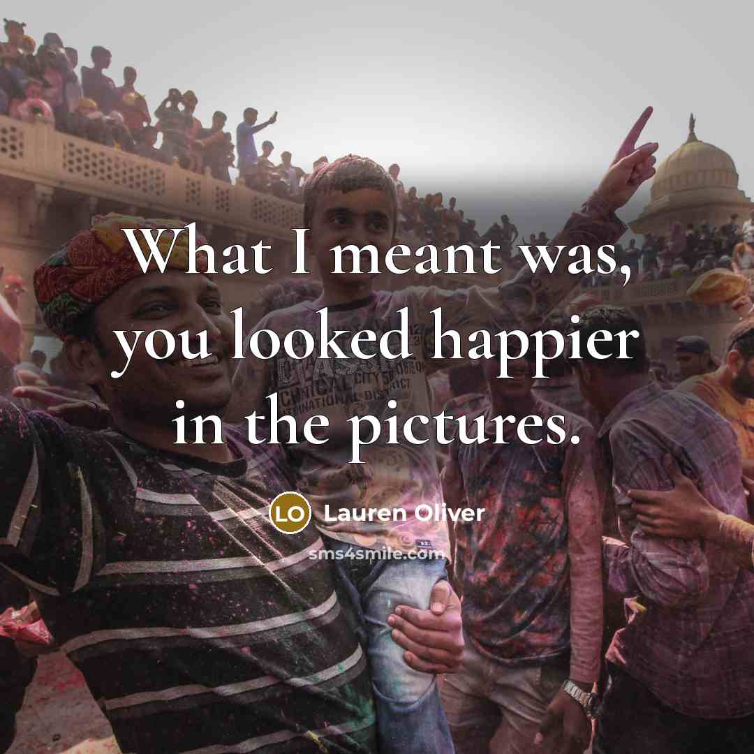 “What I meant was, you looked happier in the pictures.…” quote by Lauren Oliver